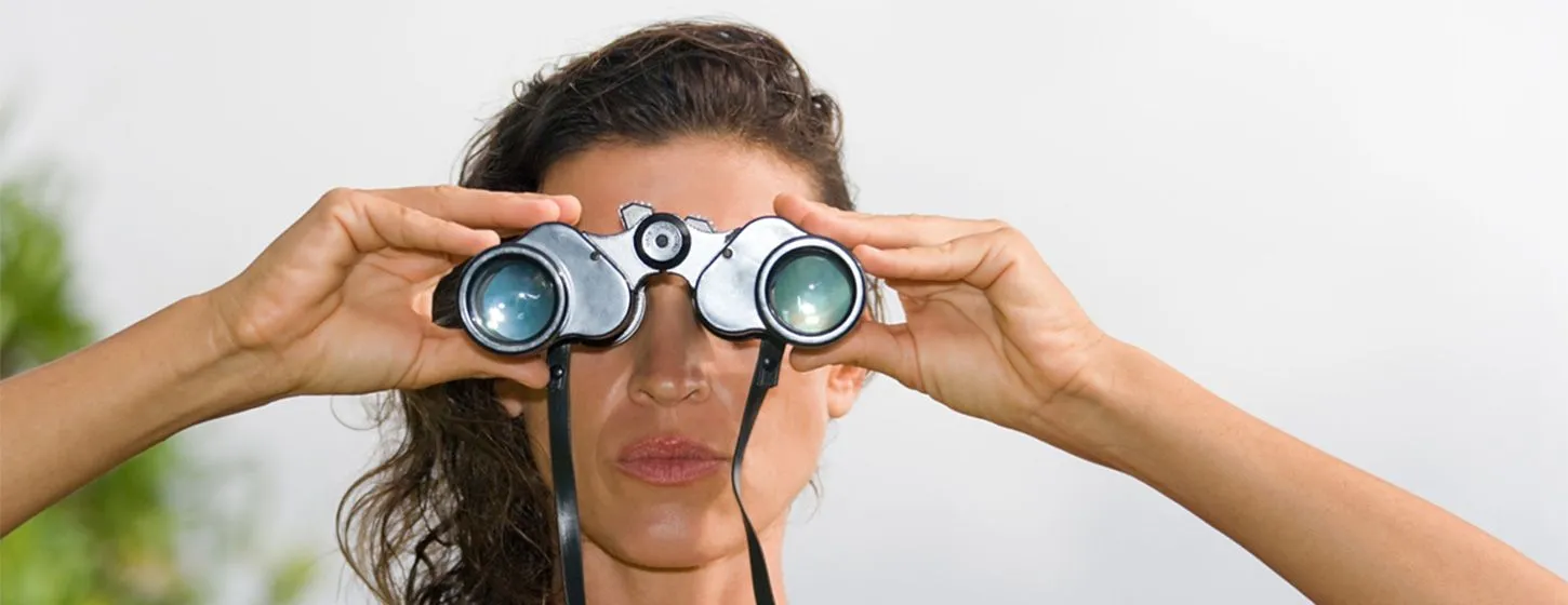 Woman looking through binoculars