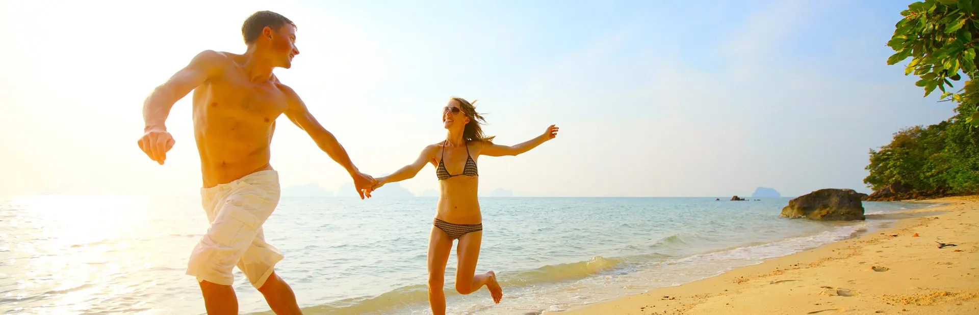 Couple running along the beach